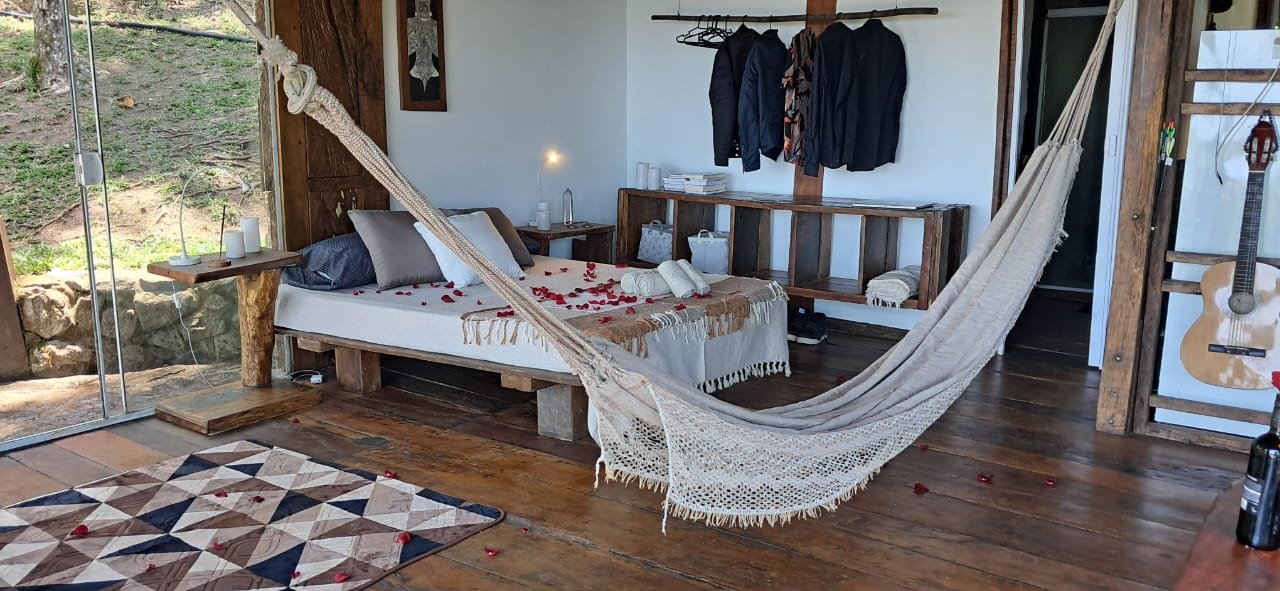 The living room, with the sofa bed and a hammock